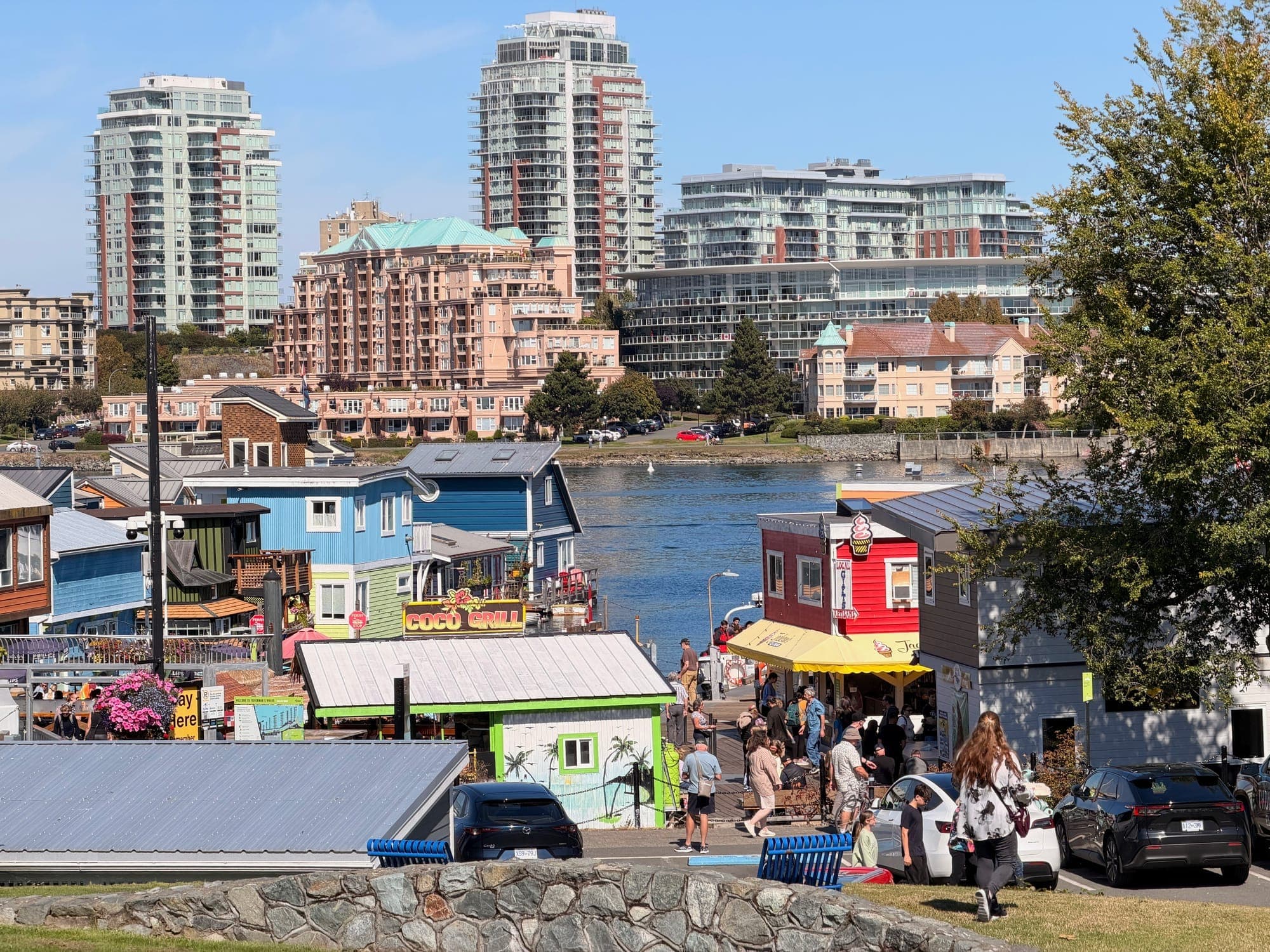 Float homes at Fisherman's Wharf with the city towers rising behind